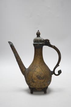 An Indian Islamic brass ewer, 27cm high